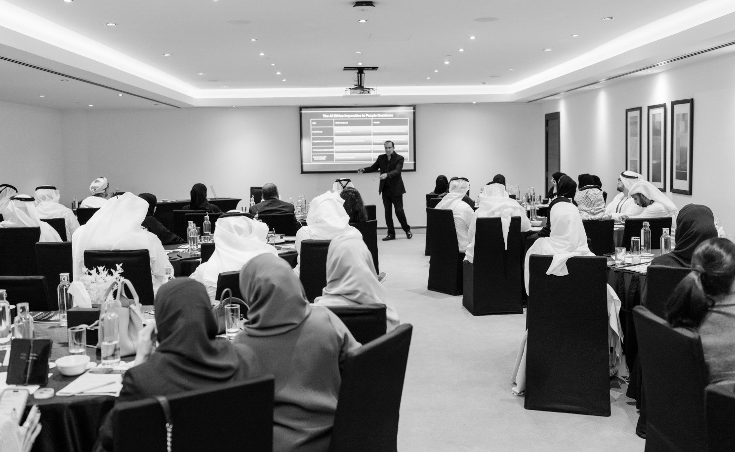 A full workshop room of HR leaders during a conference session