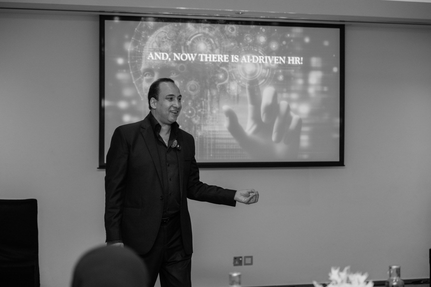 Mostafa Azzam presenting a slide on AI-driven HR
